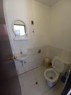 a bathroom with a toilet and a sink at Imperial Golden House Inn in Cusco