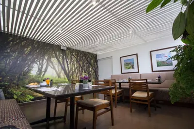 a dining room with a table and chairs at Tierra Viva Miraflores Larco in Lima