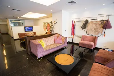 a living room with a couch and two chairs at Tierra Viva Miraflores Larco in Lima