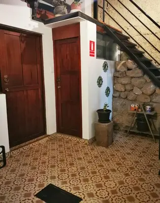 a room with a staircase and a door at Casa Durand in Cusco