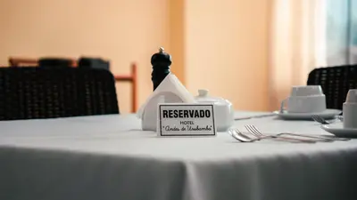 a white table with a sign on top of it at Hotel Andes Urubamba in Urubamba