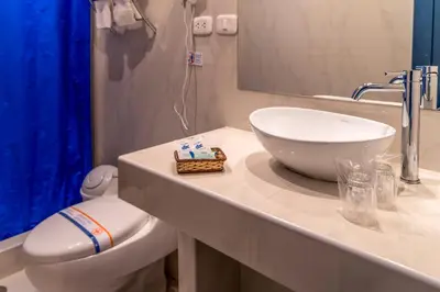a bathroom with a sink and a toilet at La Casa de Fray Bartolome in Cusco