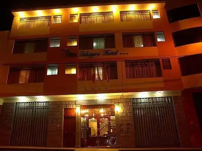 a building with a sign on the front of it at Hotel Inkayra in Cusco