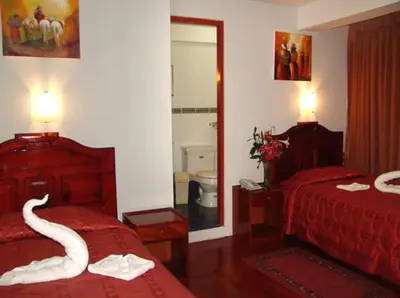 a hotel room with a swan made out of towels at Hotel Inkayra in Cusco