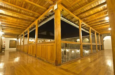 a large wooden horse stall in a building at Tierra Viva Cusco Centro in Cusco