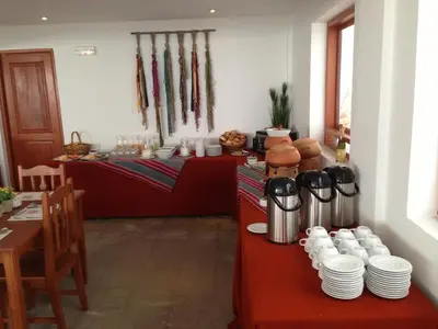 a room with a table with plates and cups on it at Tierra Viva Cusco Centro in Cusco