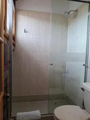 a bathroom with a shower with a toilet and a sink at Casona La Recoleta in Cusco