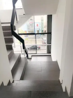 a staircase in a building with a view of a street at Departamento Miraflores in Lima