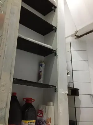 an open refrigerator door with food items in it at Asiriq Wasi Guest House in Cusco