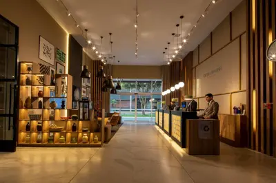 a man standing at a counter in a store at Casa Andina Premium San Isidro in Lima