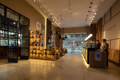 two people standing at a counter in a store at Casa Andina Premium San Isidro in Lima