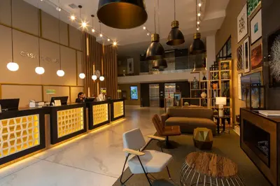 a lobby of a store with a couch and chairs at Casa Andina Premium San Isidro in Lima