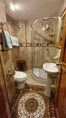 a bathroom with a shower and a toilet and a sink at Casona Corrales Hotel Boutique in Cusco