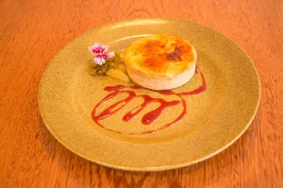 a plate of food with a pastry on a table at Hotel Britania Crystal Collection in Lima