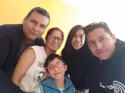 a group of people posing for a picture at Chakana Family Home Lima Airport in Lima