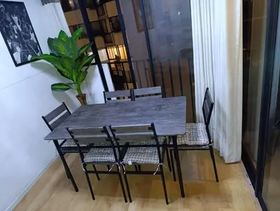 a wooden table and chairs in a room at Pet Friendly Apart-Maximo 9 Personas-Piscina-Parrilla-Billar-Gimnasio in Lima