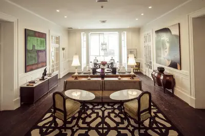 a living room with a couch and a table and chairs at Hotel B in Lima
