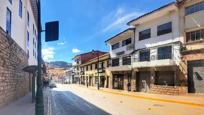 an empty street in a city with buildings at Apartamento a pasos de la Plaza Cusco Inlove in Cusco