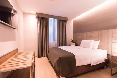 a hotel room with a bed and a window at Surya Lima in Lima