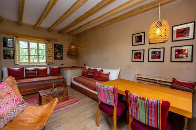 a living room with a table and a couch at NUNA by DCO in Urubamba