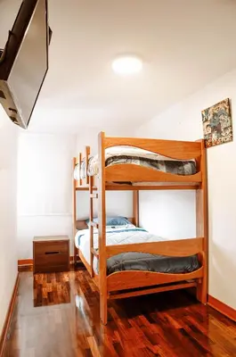 a bedroom with two bunk beds in a room at Hermoso departamento en el Corazón de Miraflores in Lima