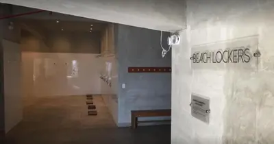 a lobby of a building with a sign on the wall at Departamento de playa - Condominio OCEAN REEF - SAN BARTOLO in San Bartolo