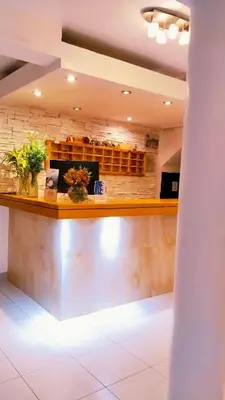 a bar in a restaurant with plants on the counter at Fenix Hotel Machupicchu in Machu Picchu