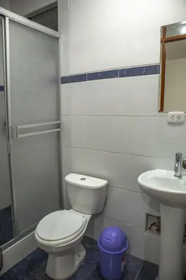 a bathroom with a toilet and a sink at Hotel Del Prado Hometown in Cusco