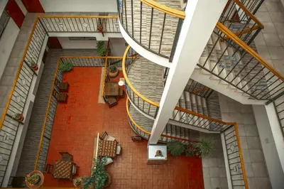 an overhead view of a spiral staircase in a building at Hotel Del Prado Hometown in Cusco