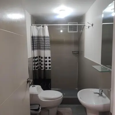 a bathroom with a toilet and a sink and a shower at CASA SAPANTIANA, cerca a Sacsayhuaman in Cusco