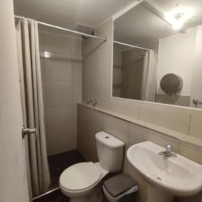 a bathroom with a toilet and a sink at CASA SAPANTIANA, cerca a Sacsayhuaman in Cusco