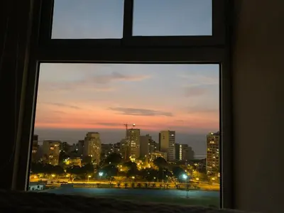 a view of a city skyline from a window at Connect in Lima