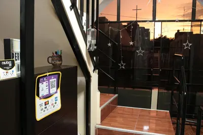 a door with a window with a view of a city at Peruvian Wasi - Bed & Breakfast in Lima