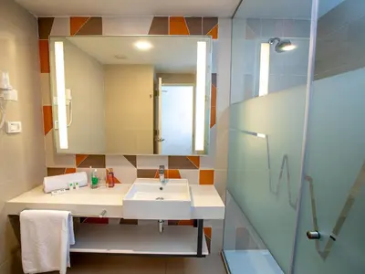 a bathroom with a sink and a mirror at ibis Styles Lima Benavides Miraflores in Lima
