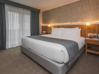 a large white bed in a hotel room at Sonesta Hotel Miraflores in Lima