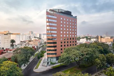 a tall building on a street in a city at Fairfield by Marriott Lima Miraflores in Lima