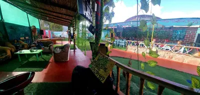 a view from a balcony of a carnival ride at Valle verde, Hostel & camping in Urubamba