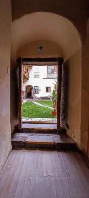 an open door to a room with a view of a building at Loki Cusco in Cusco