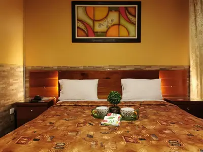 a bedroom with a large bed with money on it at Hotel Dia y Noche in Lima