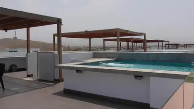 a hot tub on the roof of a building at Donde Lalo in Asia