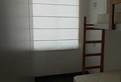 a bedroom with a ladder and a bunk bed at Donde Lalo in Asia