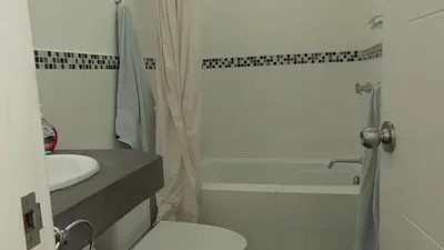 a bathroom with a toilet and a sink and a shower at Donde Lalo in Asia
