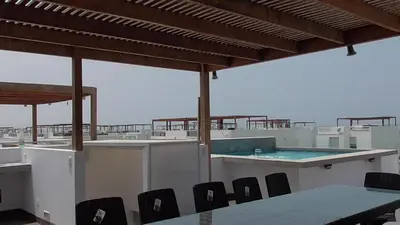 a pool on the roof of a building at Donde Lalo in Asia