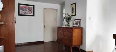 a room with a wooden dresser and a door at EL ENSUEÑO in Lima