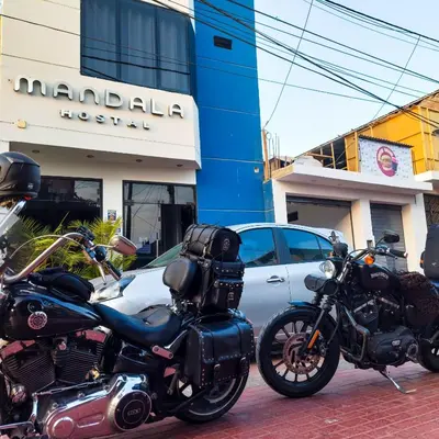 two motorcycles parked in front of a building at Mandala in Pisco