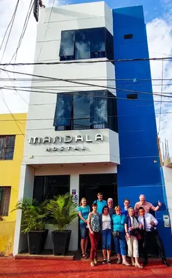 a group of people standing in front of a building at Mandala in Pisco