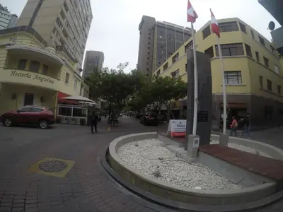 a street in a city with buildings at Waldorf in Lima
