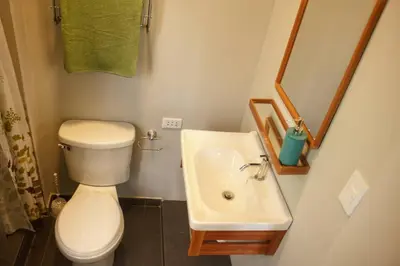 a small bathroom with a toilet and a sink at Lindo y moderno Excelente ubicación in Lima