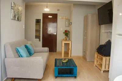 a living room with a couch and a coffee table at Lindo y moderno Excelente ubicación in Lima
