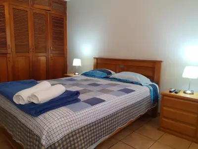a bedroom with a bed with towels on it at suite pardo CAA Miraflores in Lima